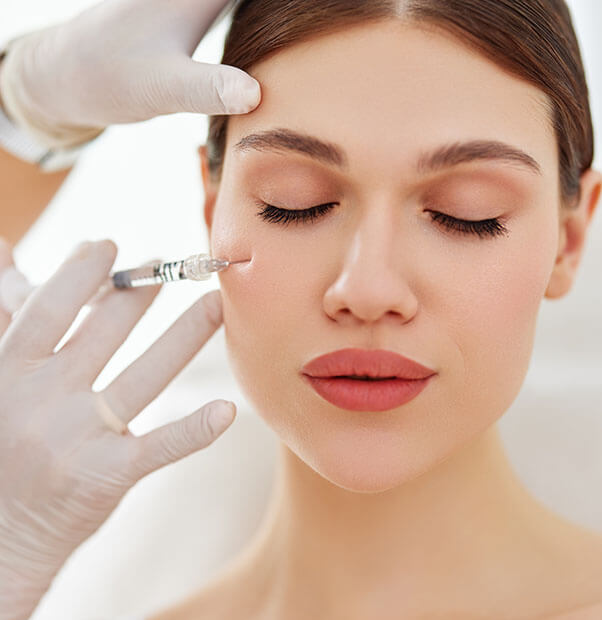Woman getting cheek Botox injection