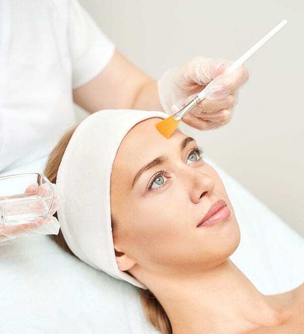Woman getting chemical peel applied