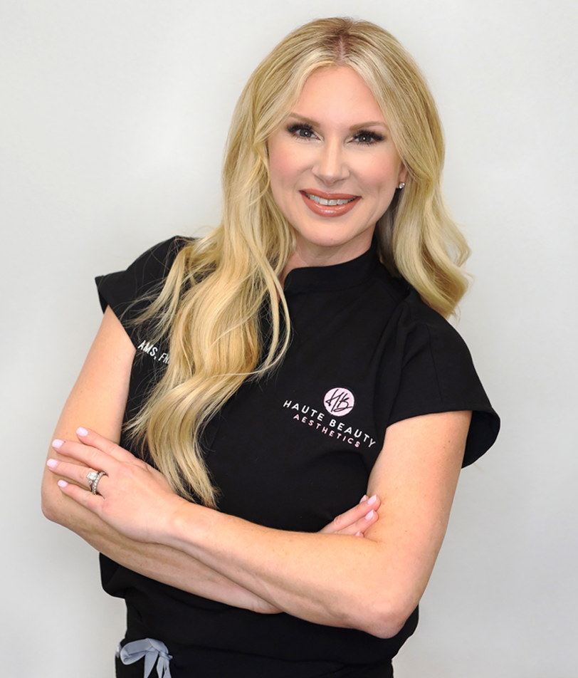 Jennifer Adams wearing a lab coat, holding a syringe